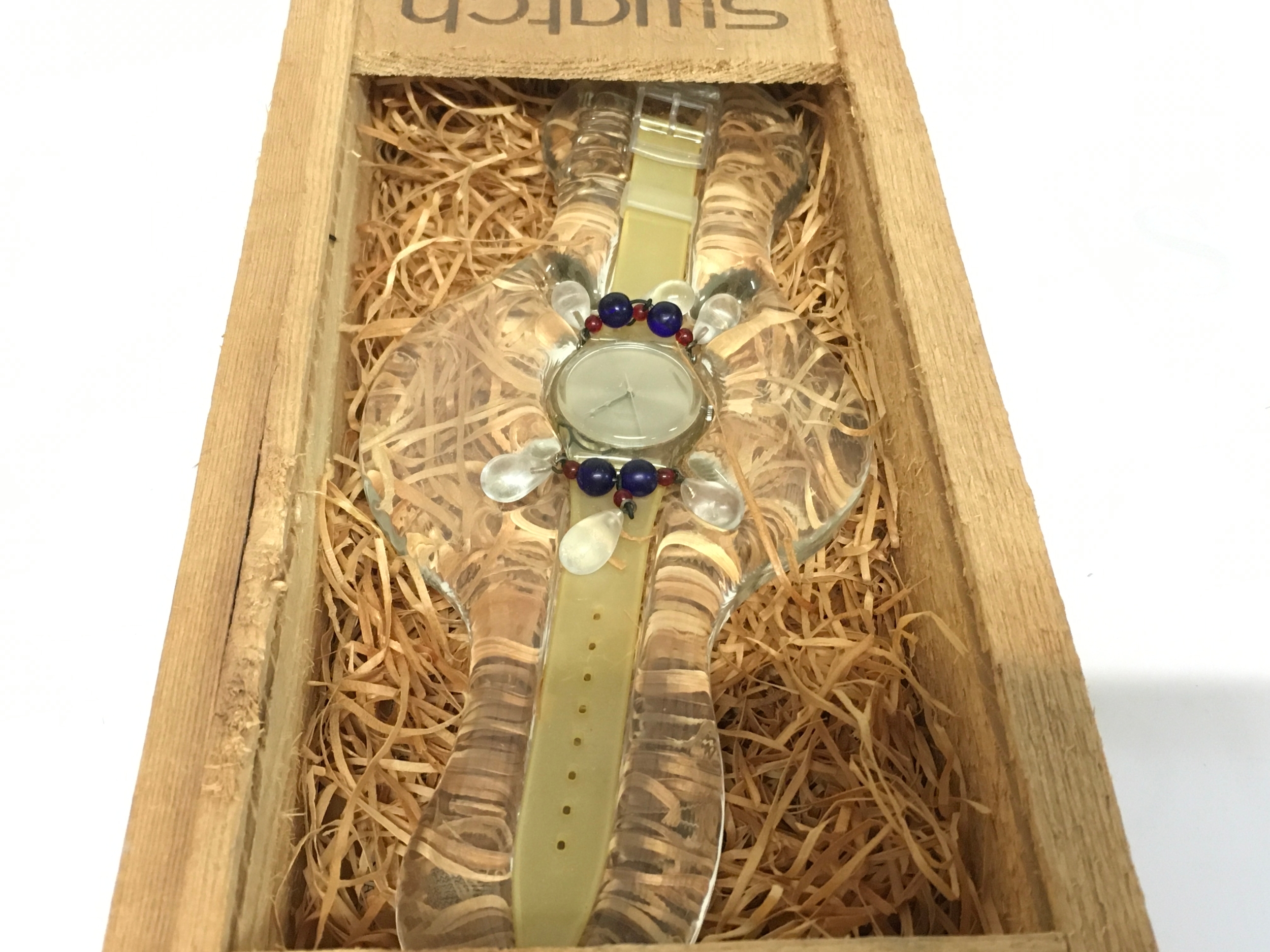 1992 Swatch "Chandelier" Christmas Special watch (GZ125), featuring distinctive dangling glass beads. Released as part of the 1992 Christmas Special collection. Comes in a specialised wooden crate with shavings.