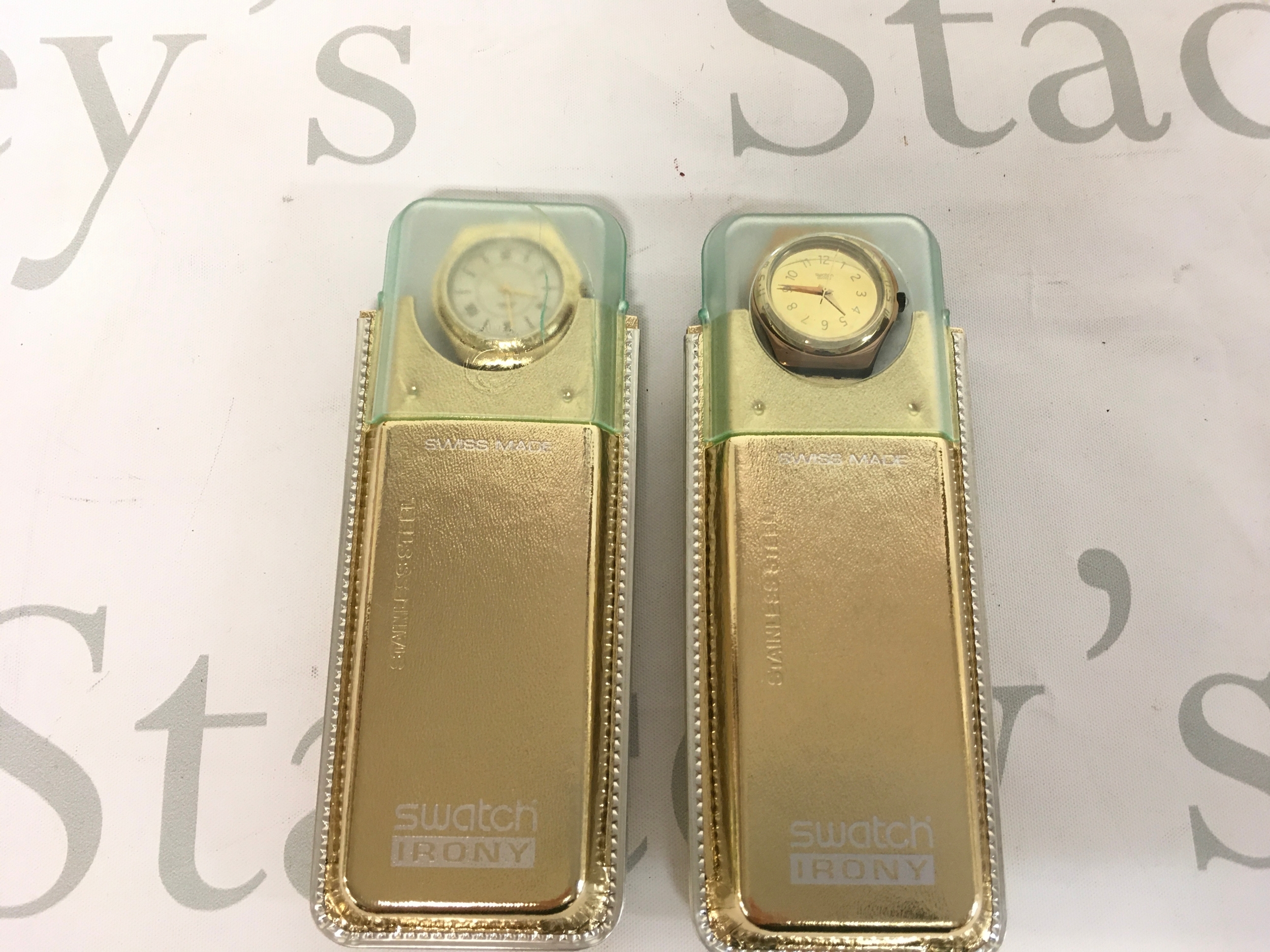 Swatch Irony Kingdom (YLG 109 & YLG111) from circa 1998 features a distinct gold-colored dial, matching gold hands, and a polished stainless steel case