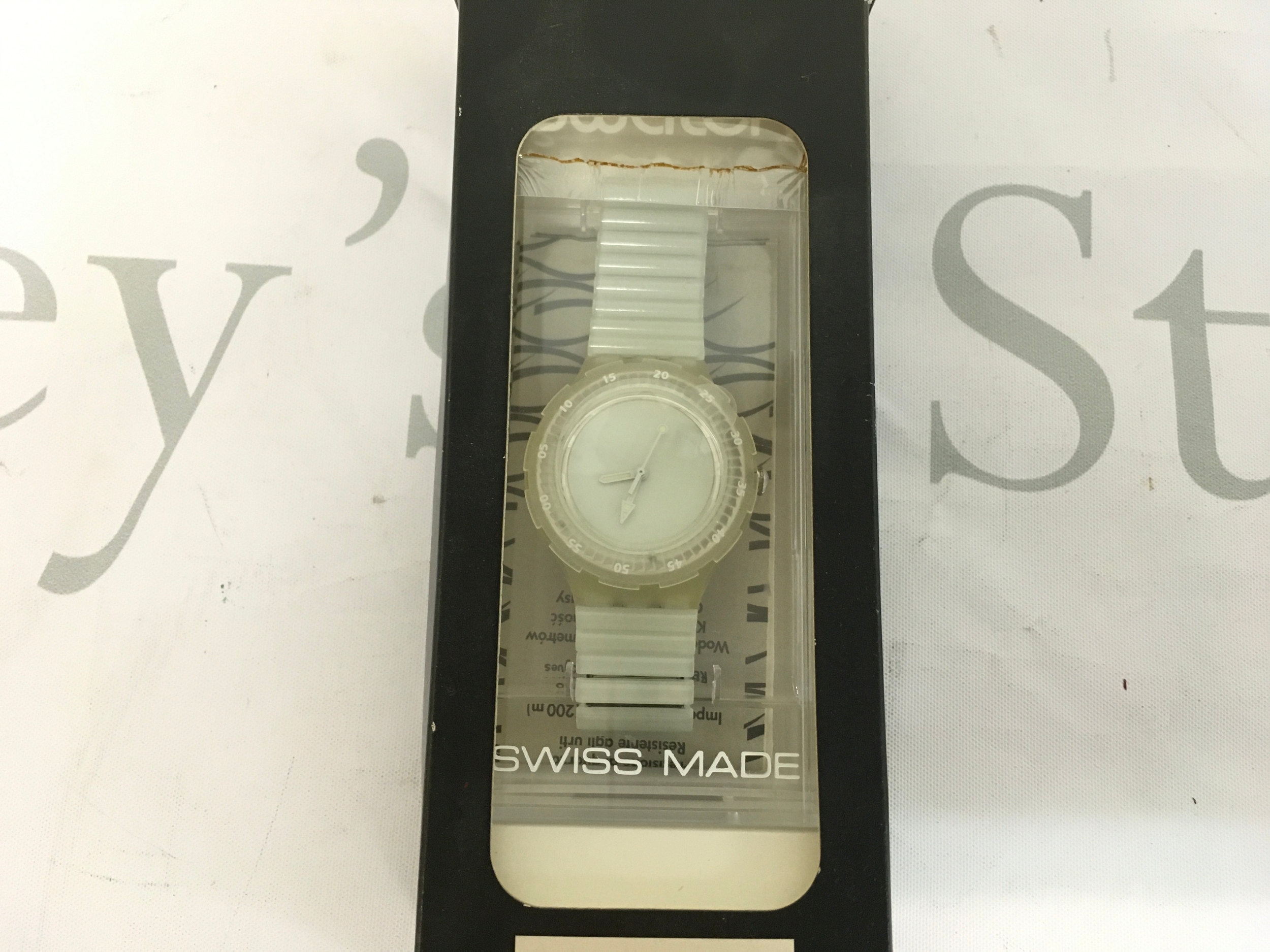 1997 Swatch Scuba 200 "King of Tides" (SDK129)watch. The watch features a distinctive glow-in-the-dark design, where the entire case and strap are fluorescent.