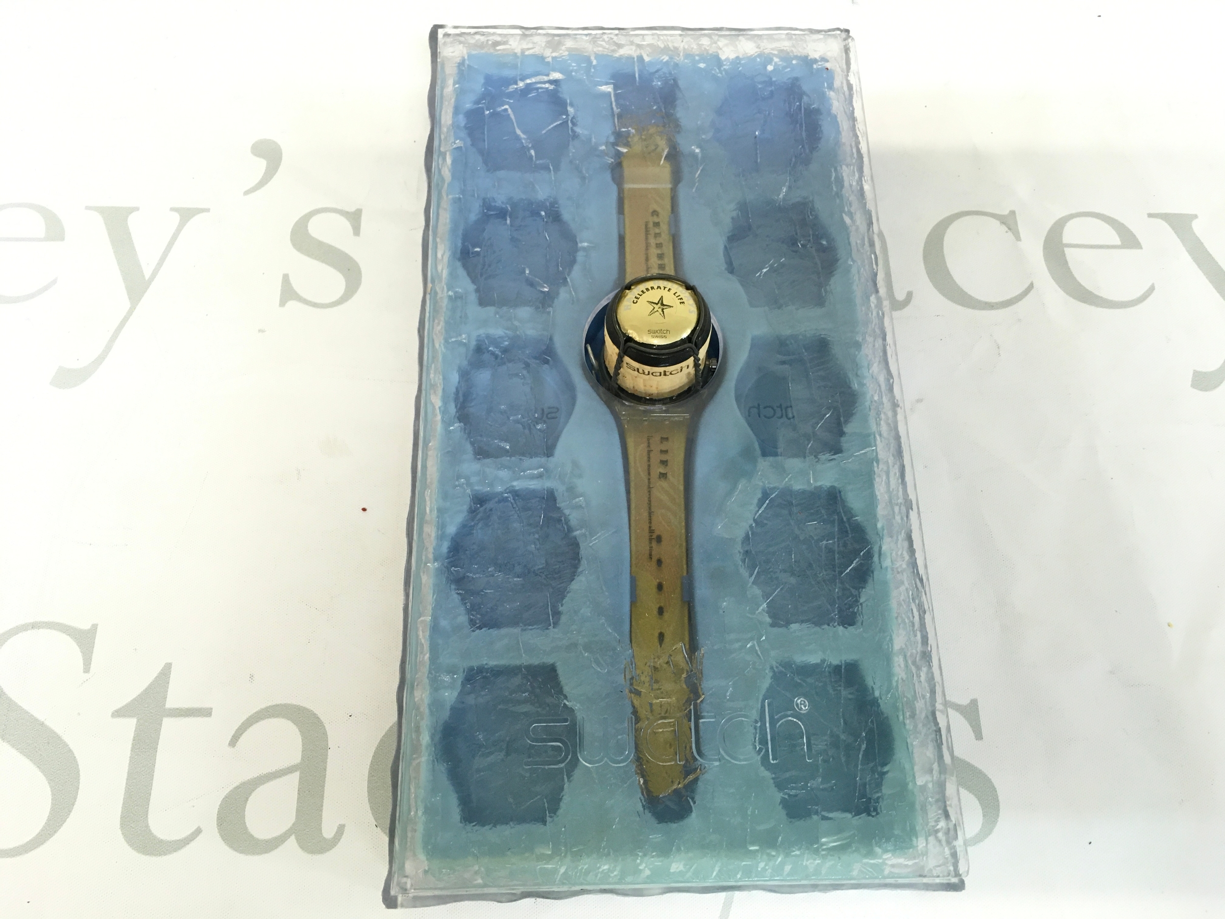 1998 Swatch Gent special titled "Sparkling Life" (model GZ902). The watch comes packaged in a unique case designed to look like a champagne bucket with a transparent ice-textured cover.