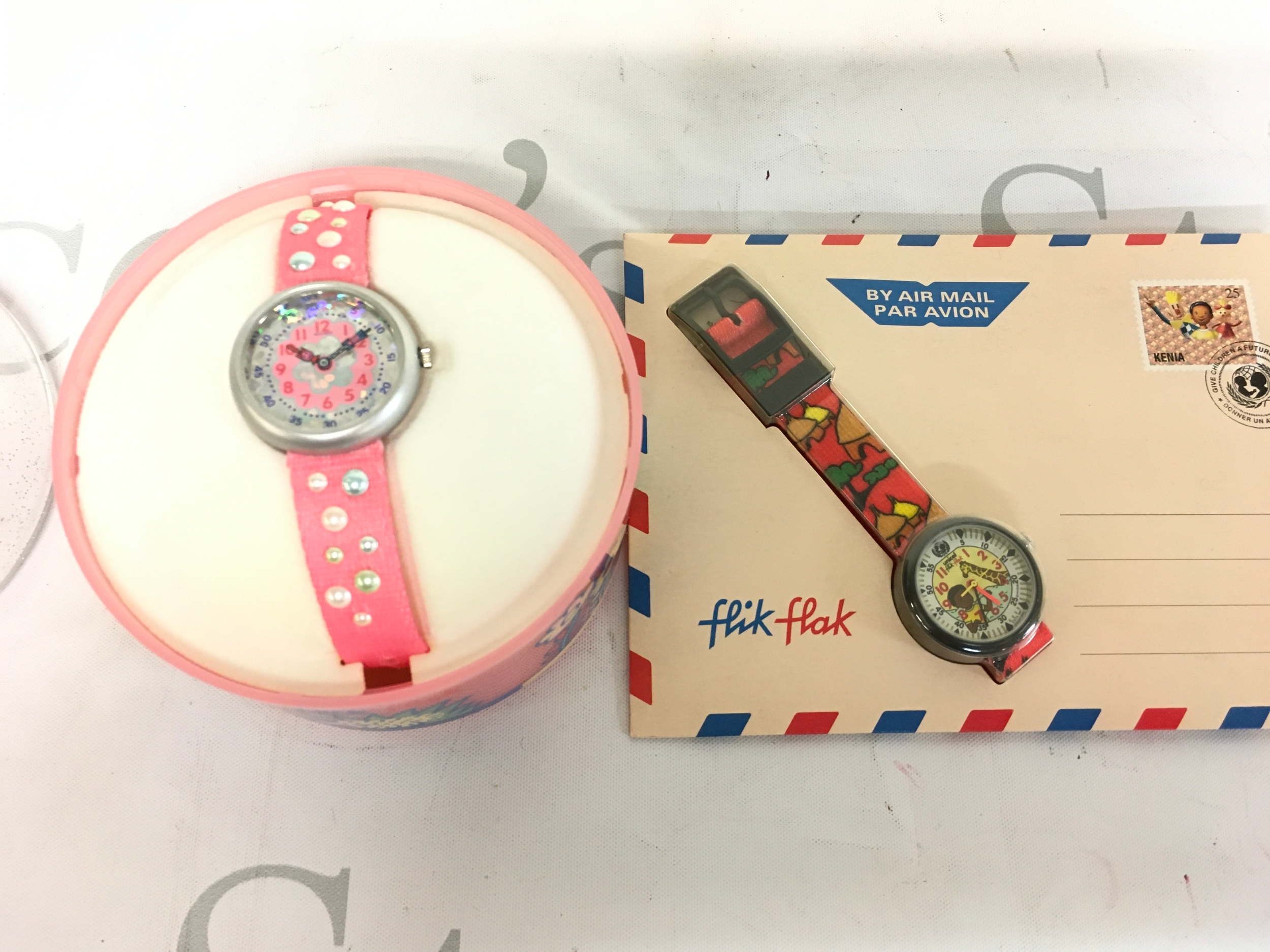 Two Flikflak watches made by swatch for children.