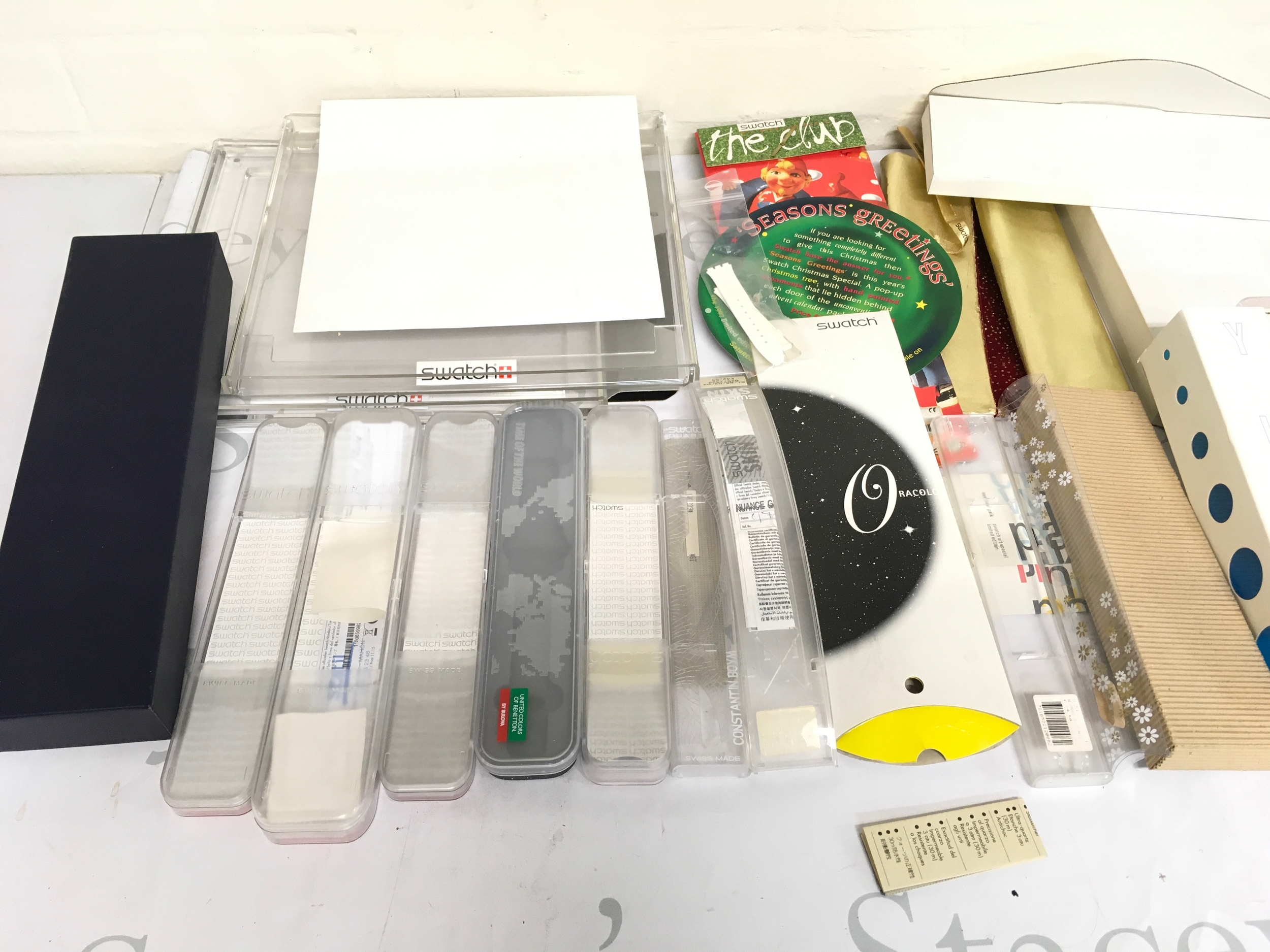 A collection of various swatch containers and packaging.