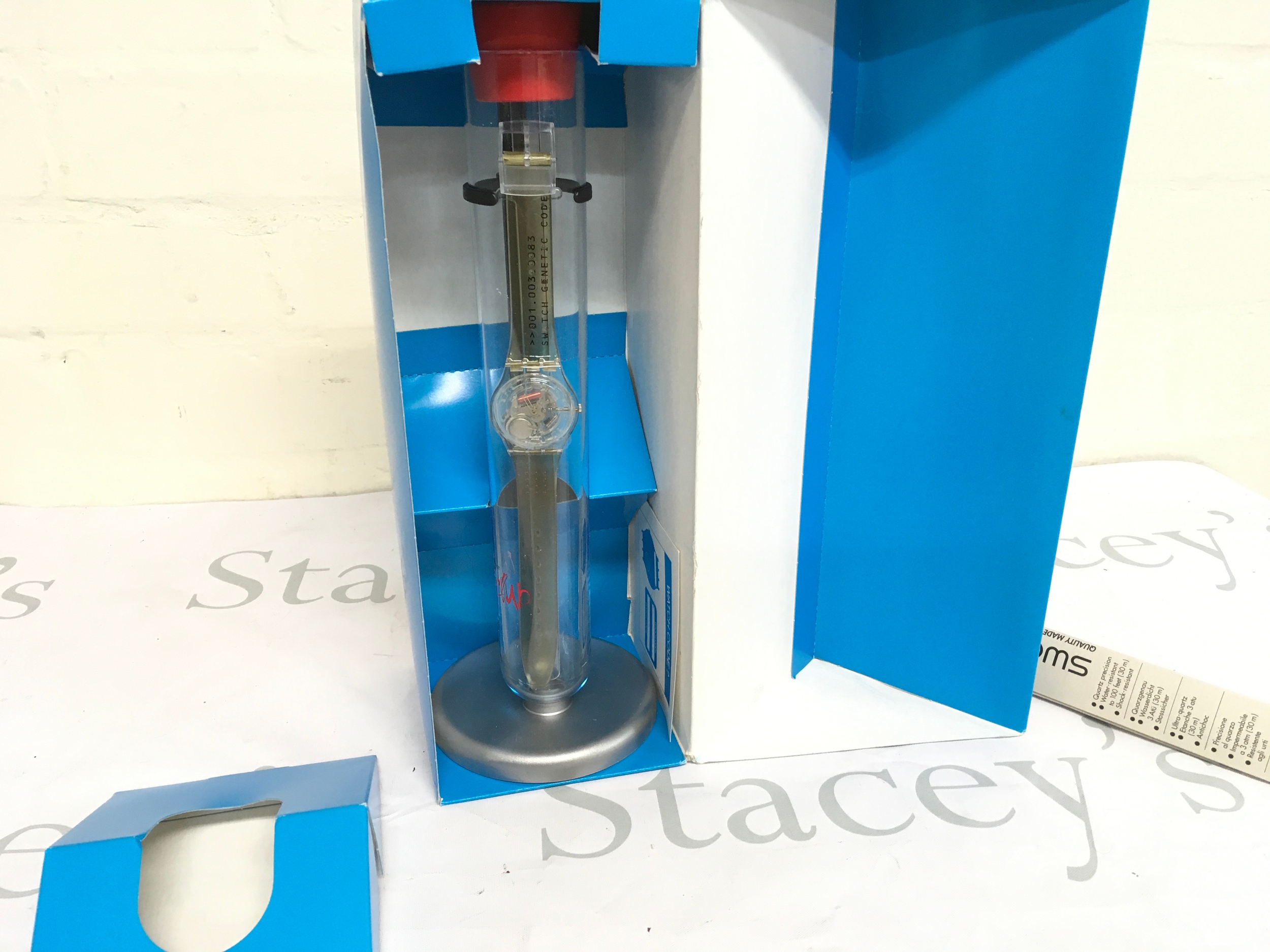 Swatch genetic code watch from 2000. Limited edition with packaging and tube stand. 