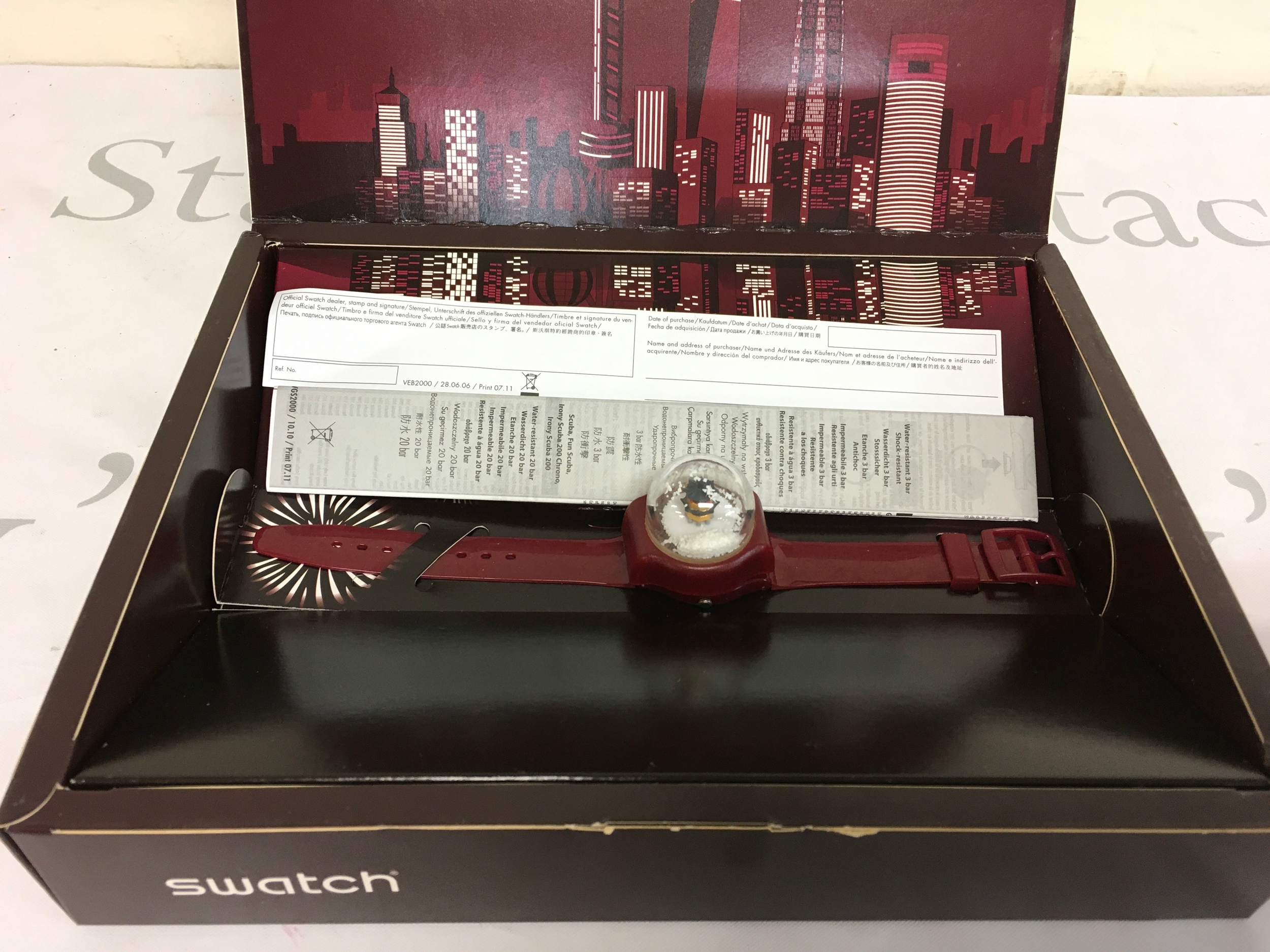 2011 Swatch X-Mas Special "Lucky Snow" (GZ259S), a limited edition watch featuring a unique snow globe dial.