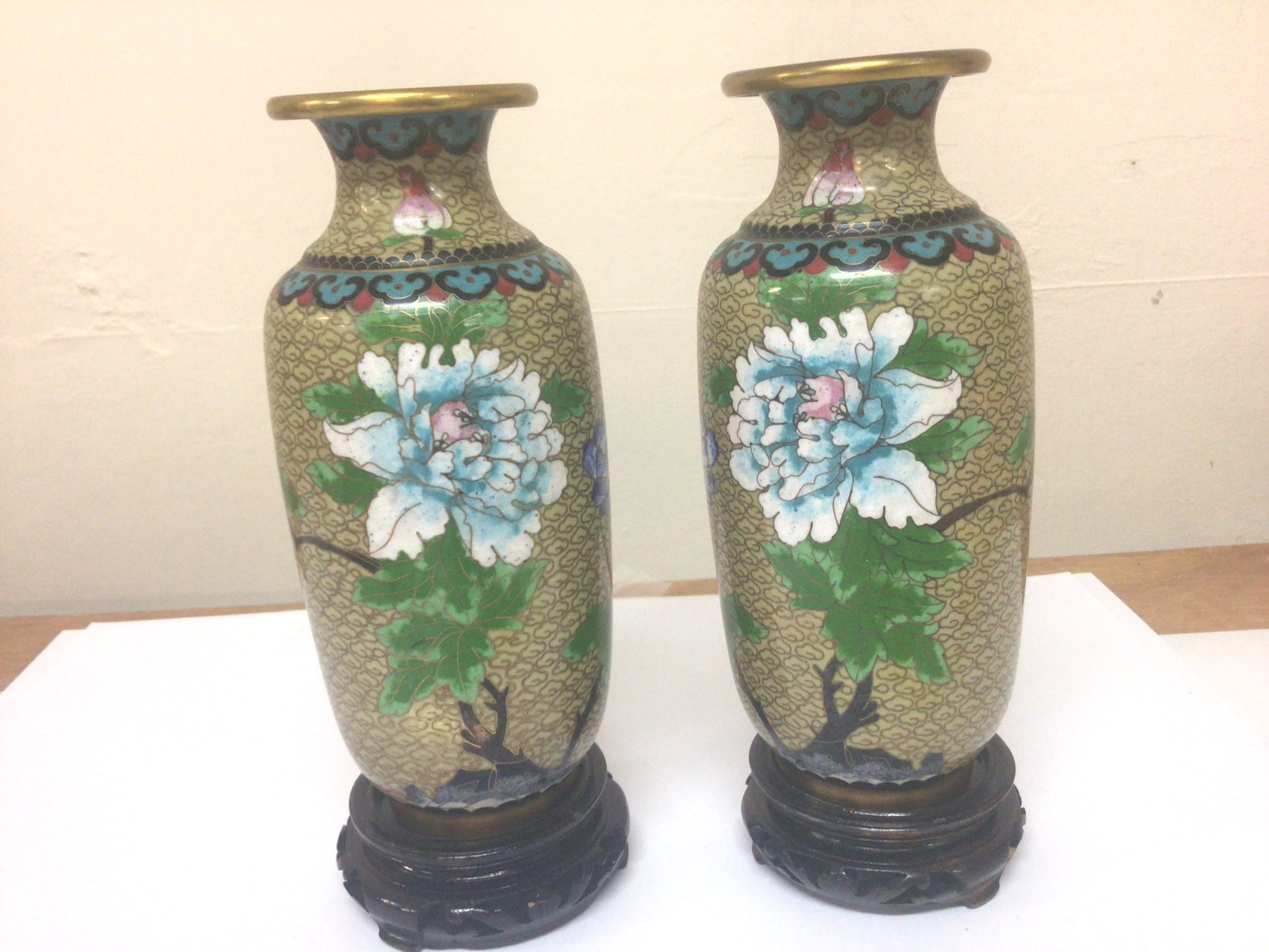  A Pair of Republic Chinese Cloisonné vases decorated with vivid coloured flowers with a repeat pattern edge Hight 21cm no obvious damage (2) 