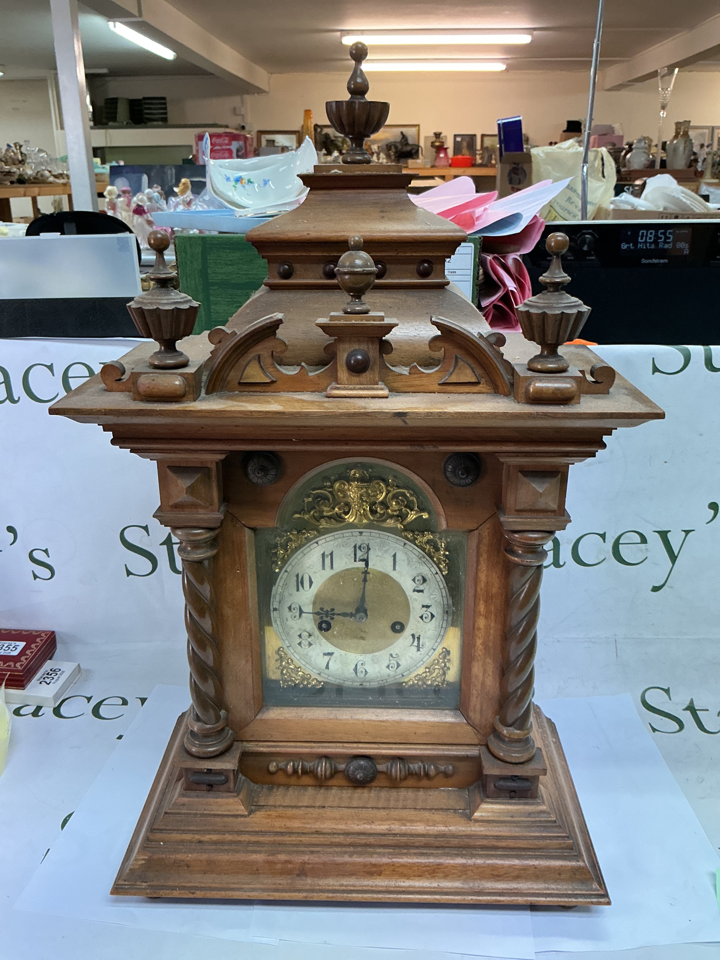 A walnut cased eight day mantle clock with Arabic numerals, approx height 61.5cm.