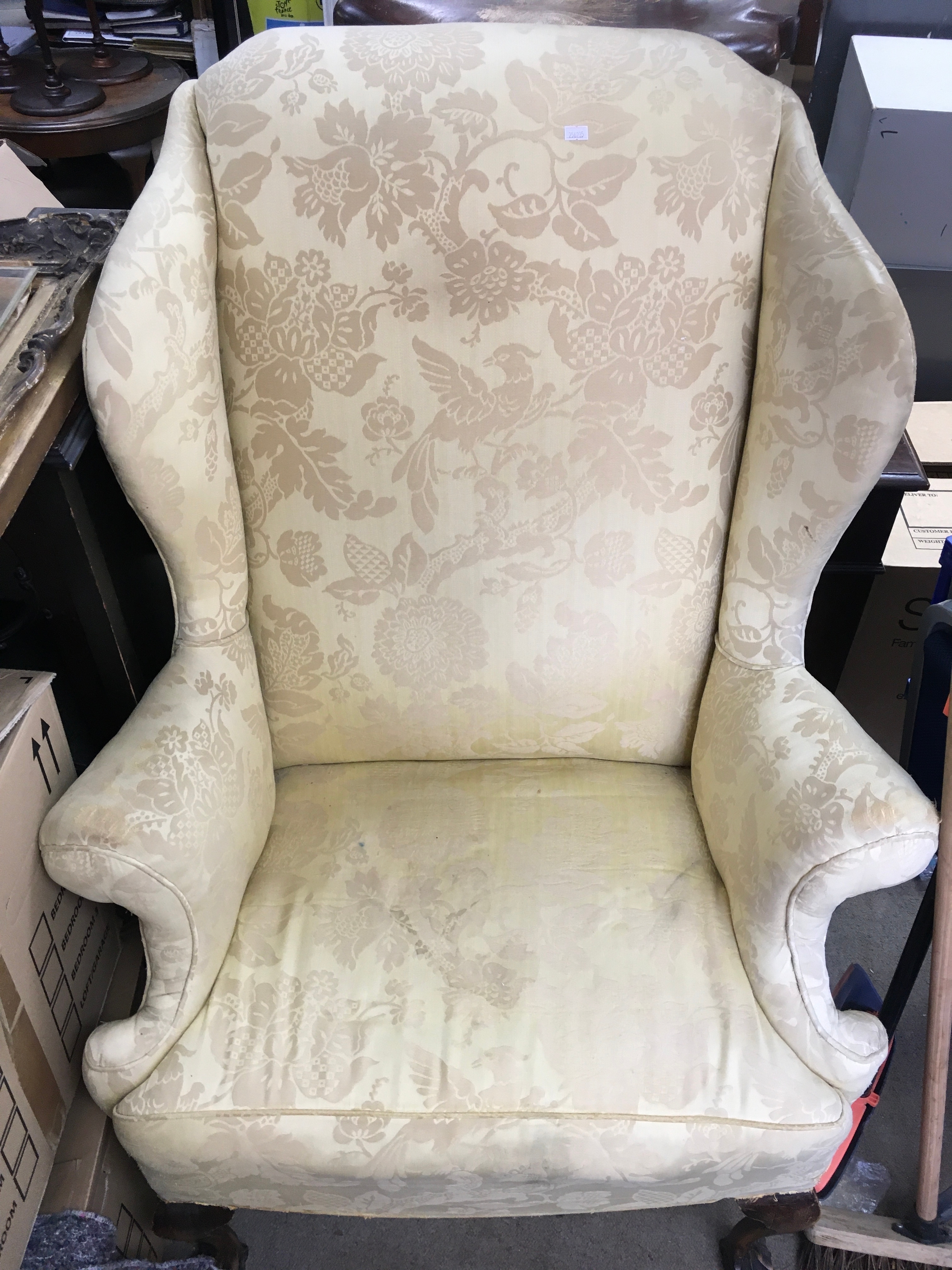 A wing back open armchair 