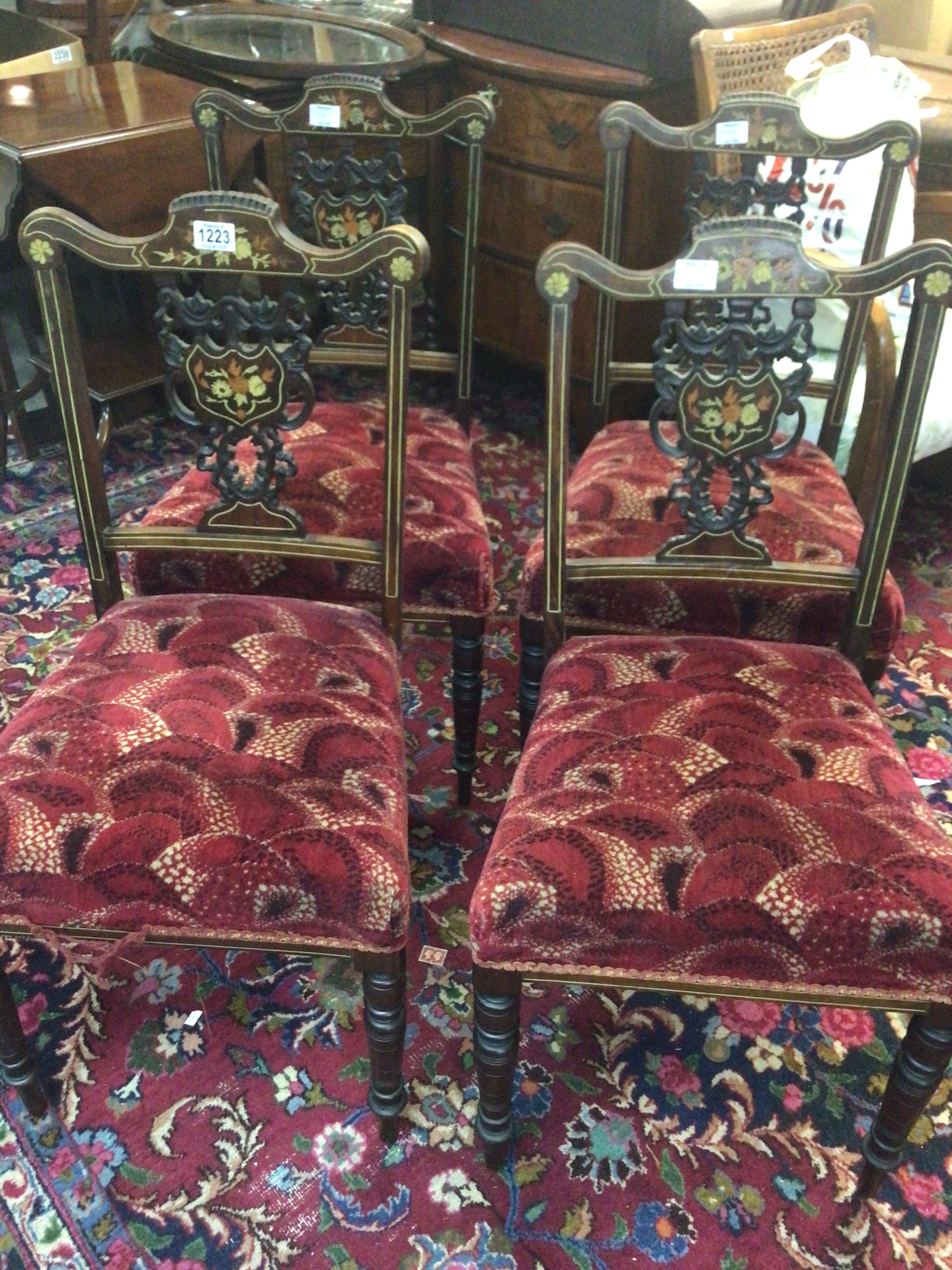  A set of four Edwardian Inlaid Rosewood dinning chairs with shaped backs (4) 