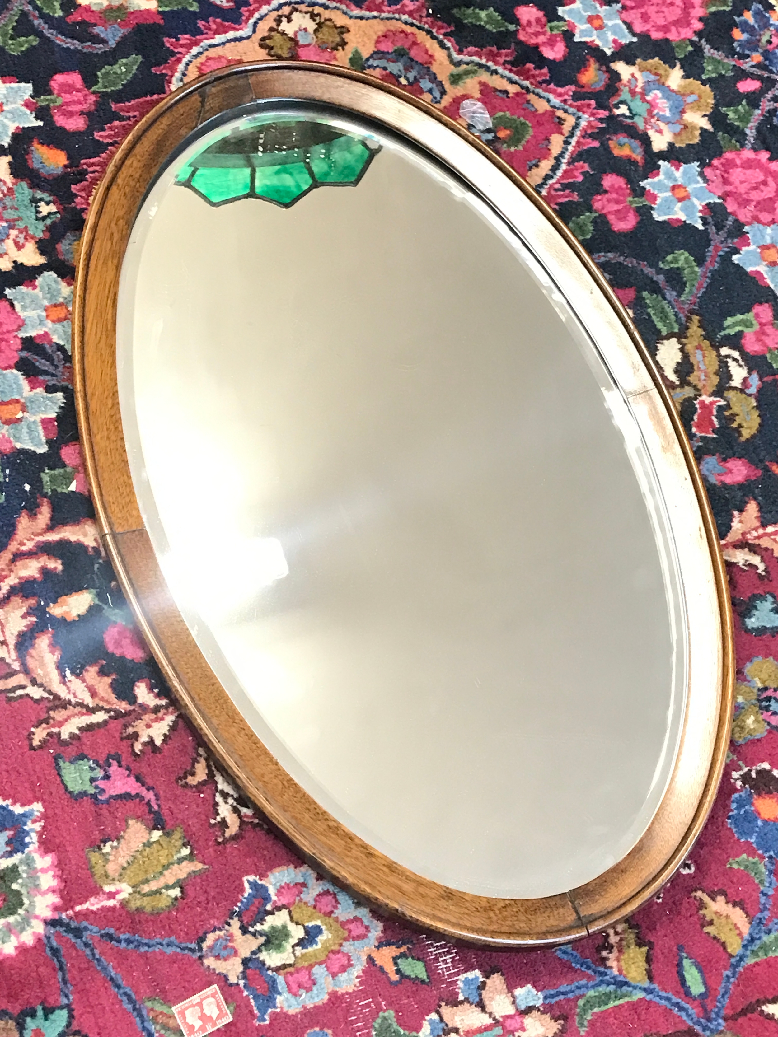 A wall mirror 70cm tall 44cm wide