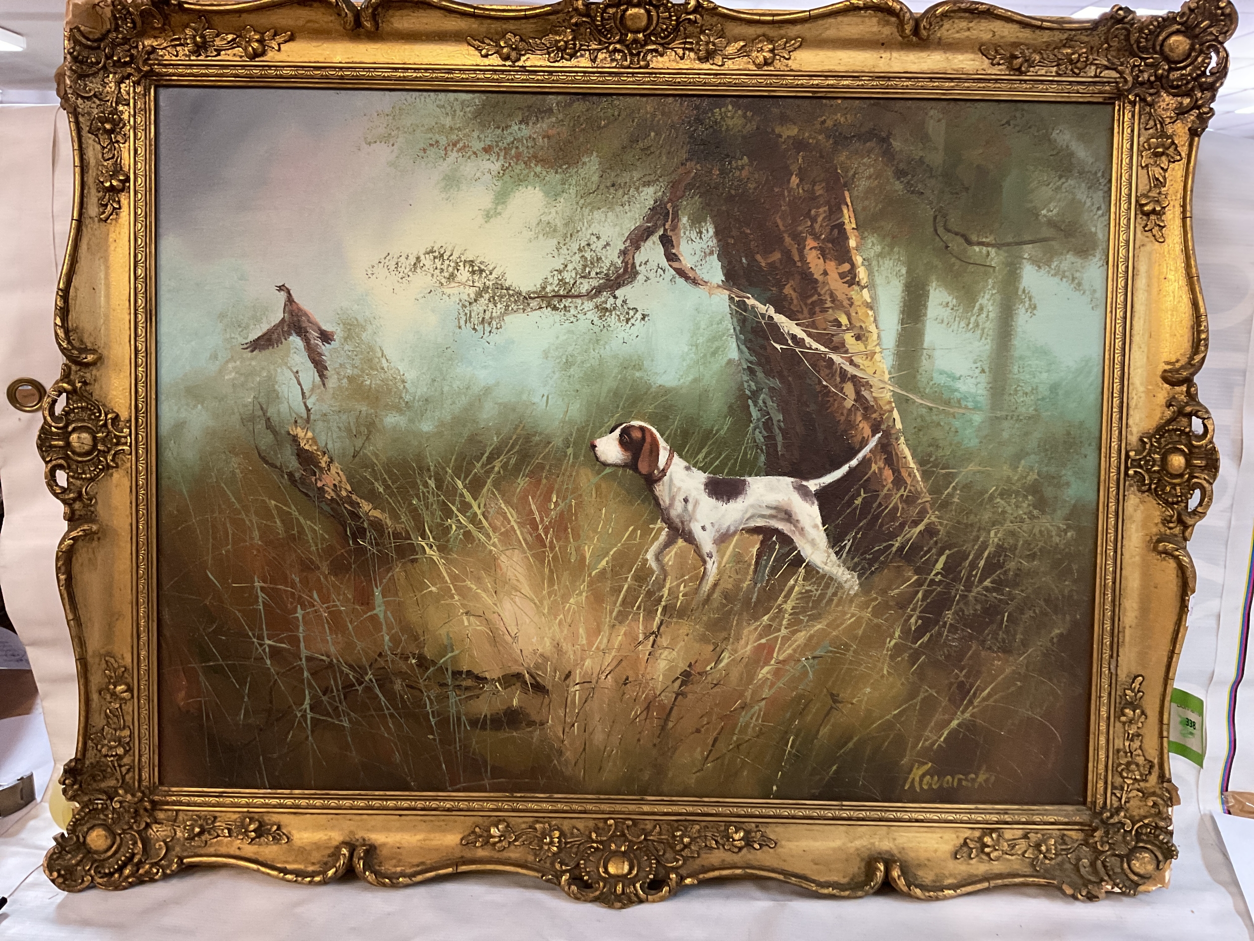 Oil on canvas of springer flushing a pheasant, signed lower right Kovarski, 45 cm x60 cm