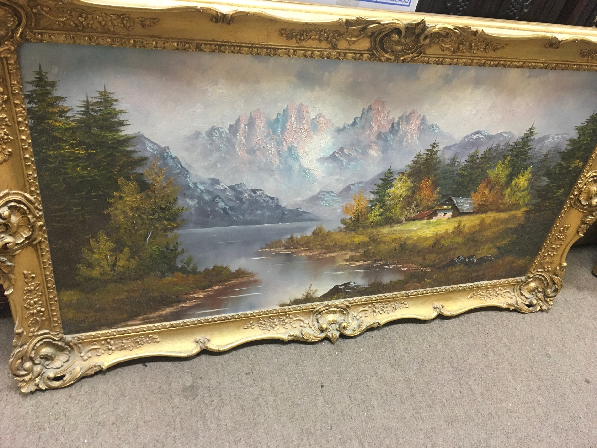 A framed oil painting 20th century view if the Swiss Alps. 116cm x 65cm