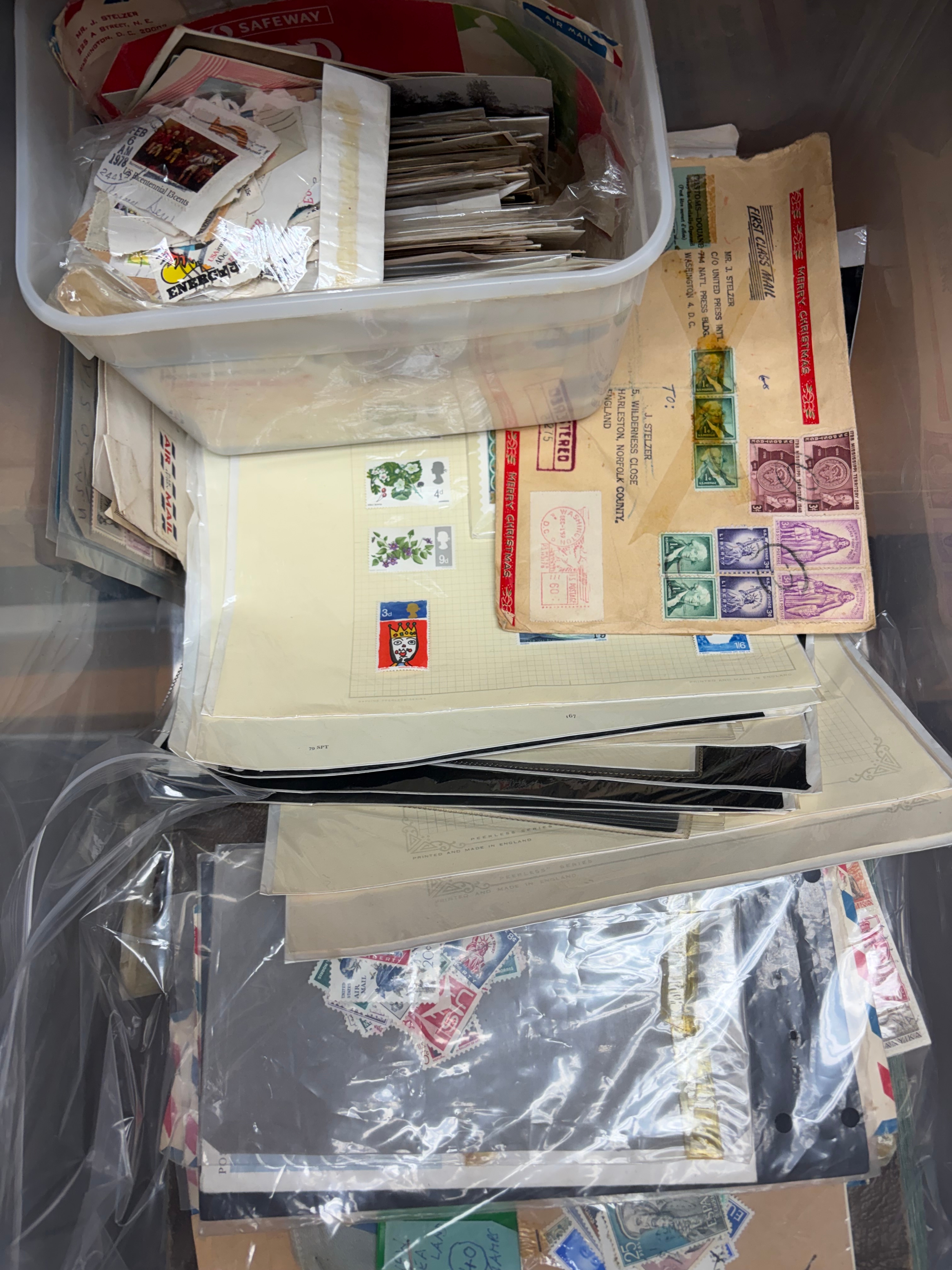 A Quantity of postcards including Edwardian era East Capital London, Military and Albums stamps to include 1866 penny red addressed album