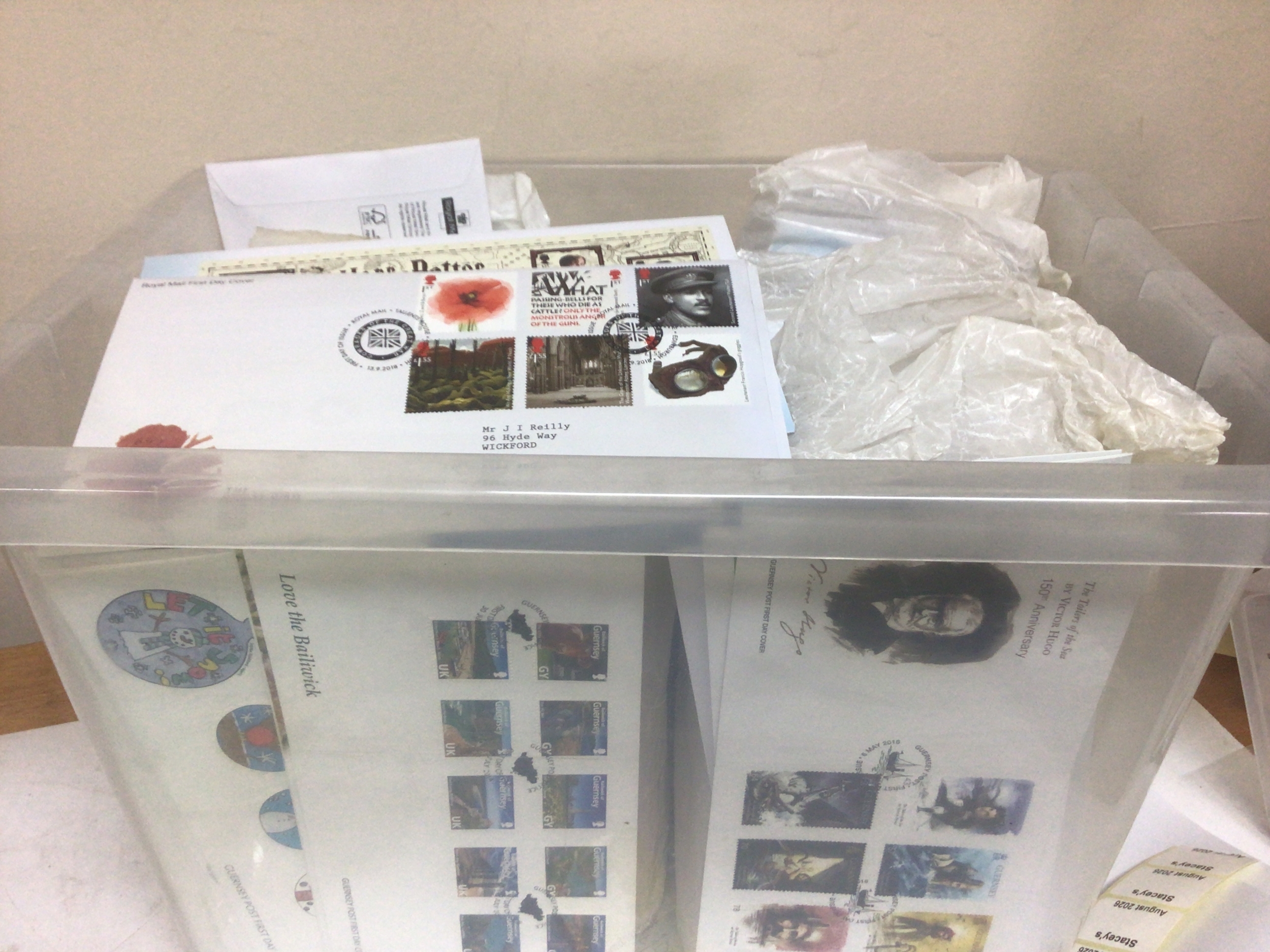 A box containing a large quantity of loose first day covers. Including Guernsey and others. 