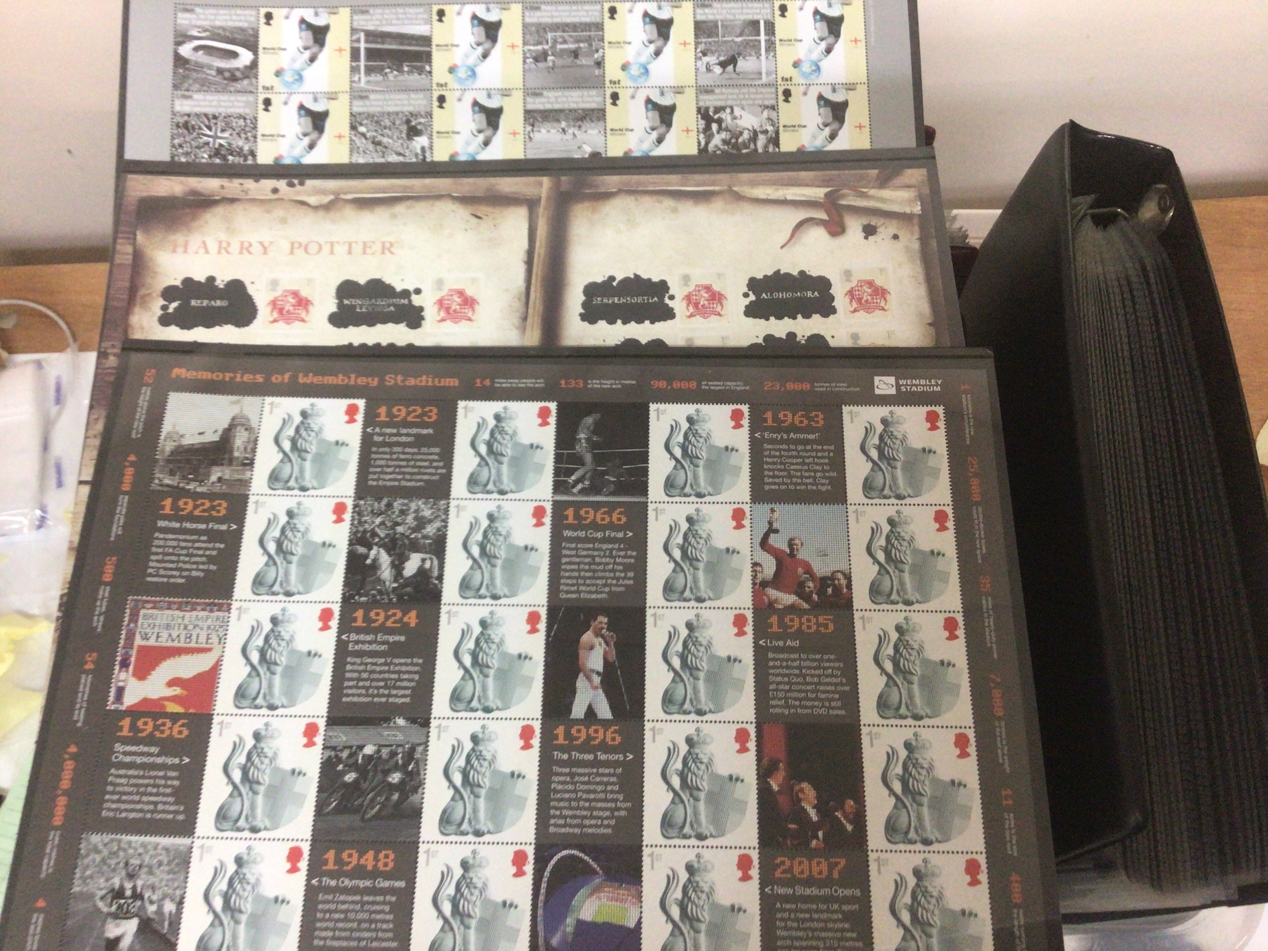  A box containing albums of first day covers Including Channel Island stamps. And a few sheets of unused British Queen Elizabeth II pictorial stamps. 