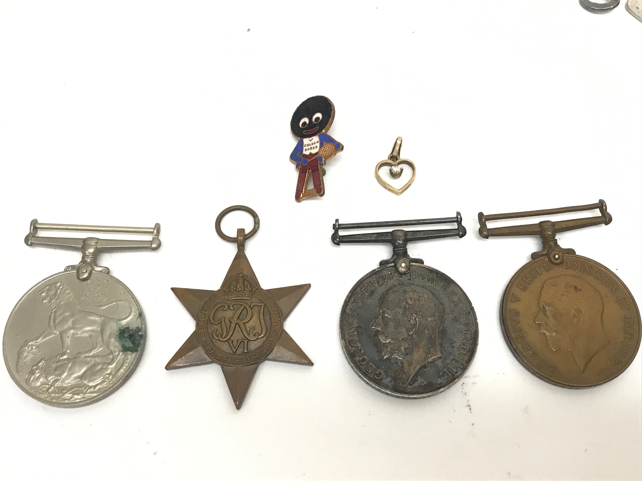 A group of medals I and II World War, war medal and Mercantile Marine War Medal 1914–1918 presented to 80495 PTE 1TG GEARING RAF and a WW2 war medal. Golly pin HW MILLER, 9ct gold pendant 