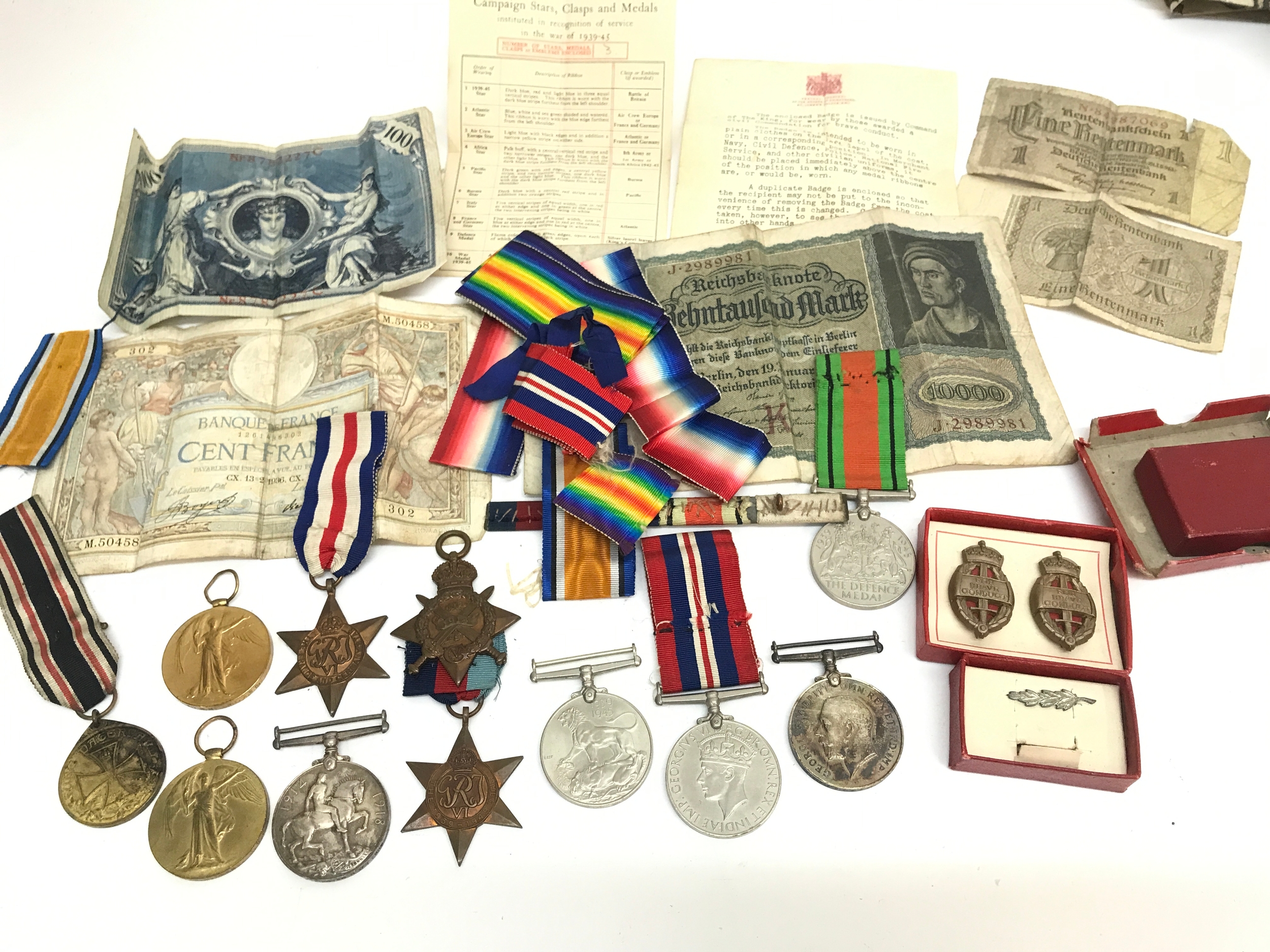 A Collection of WW1 medals awarded to (victory and war medals)SE-26712 PTE.W.J.DEEKS.A.V.C, (1914 star, victory, war medal) 4062 SJT N.MC LURIE A.S.C. Also including a German World War I "Fürs Vaterland" (For the Fatherland) Veterans' Honour Medal, German bank notes, ribbons etc