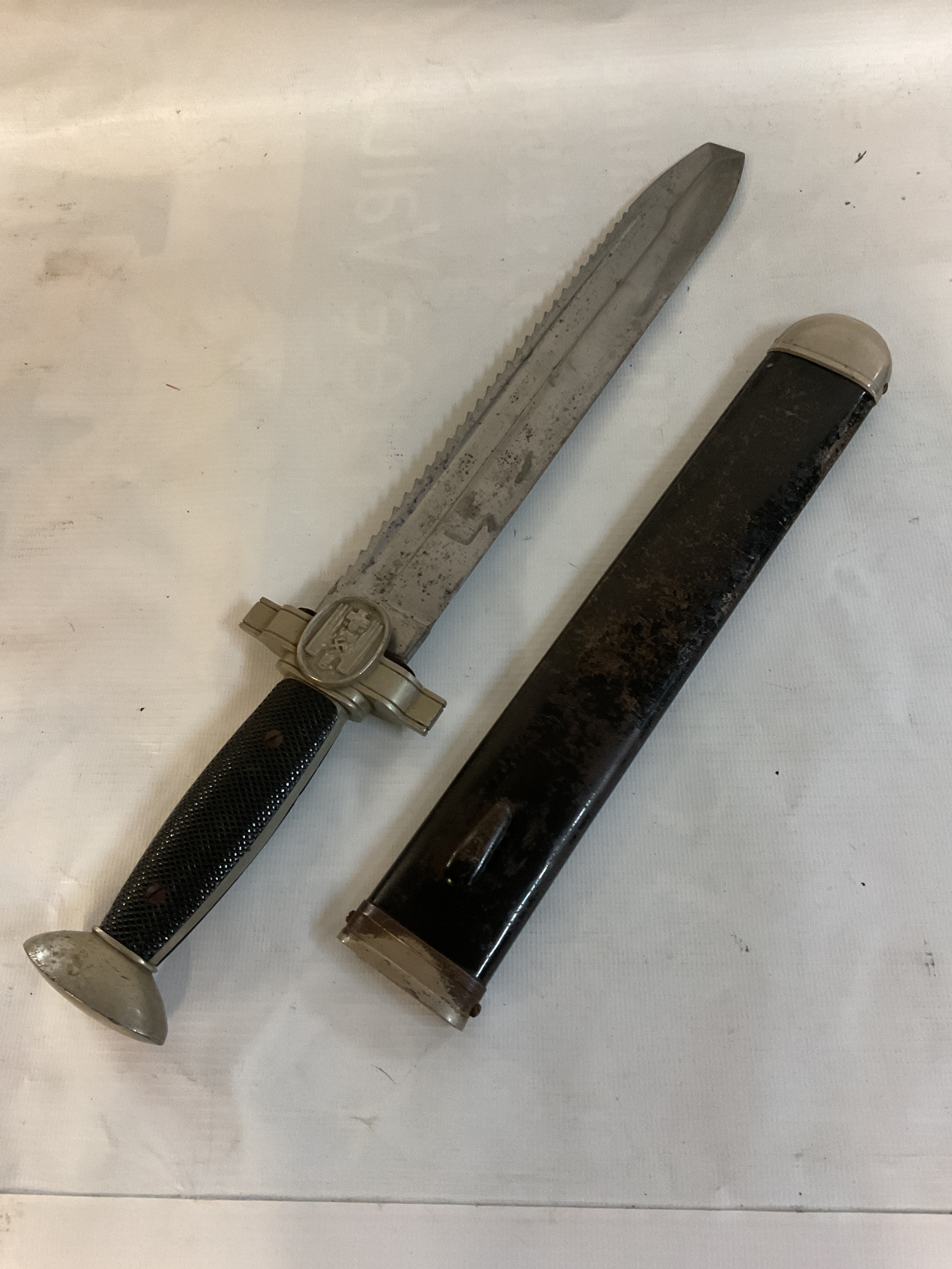 WWII German Red Cross hewer and sheath. Blade marked Geschutzt.