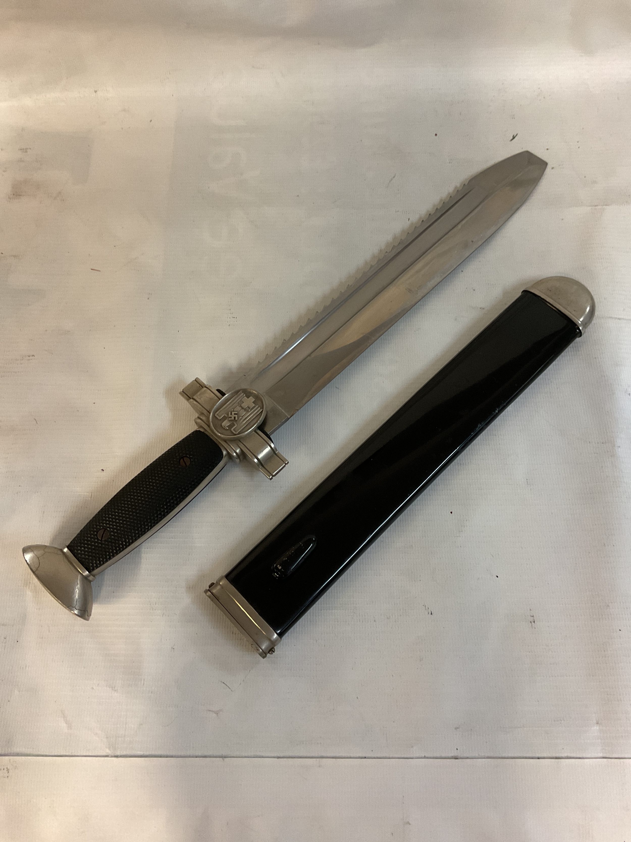 WWII German Red Cross Hewer and sheath, blade marked Geschutzt, repair to hilt to the back.