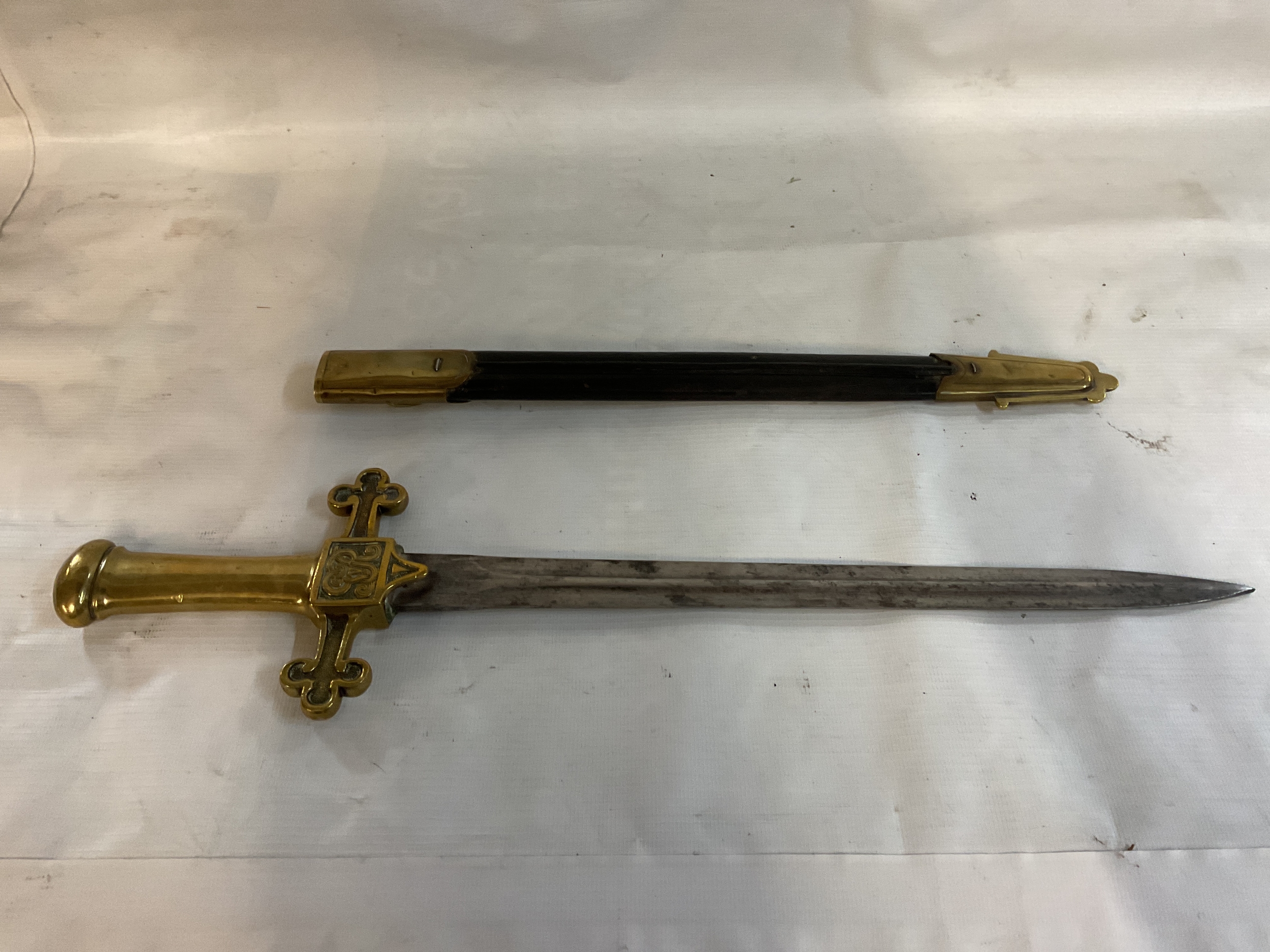 WWI English Bandsman's sidearm, brass handle with trefoil ended hilt and cypher of GVR, with sheath.