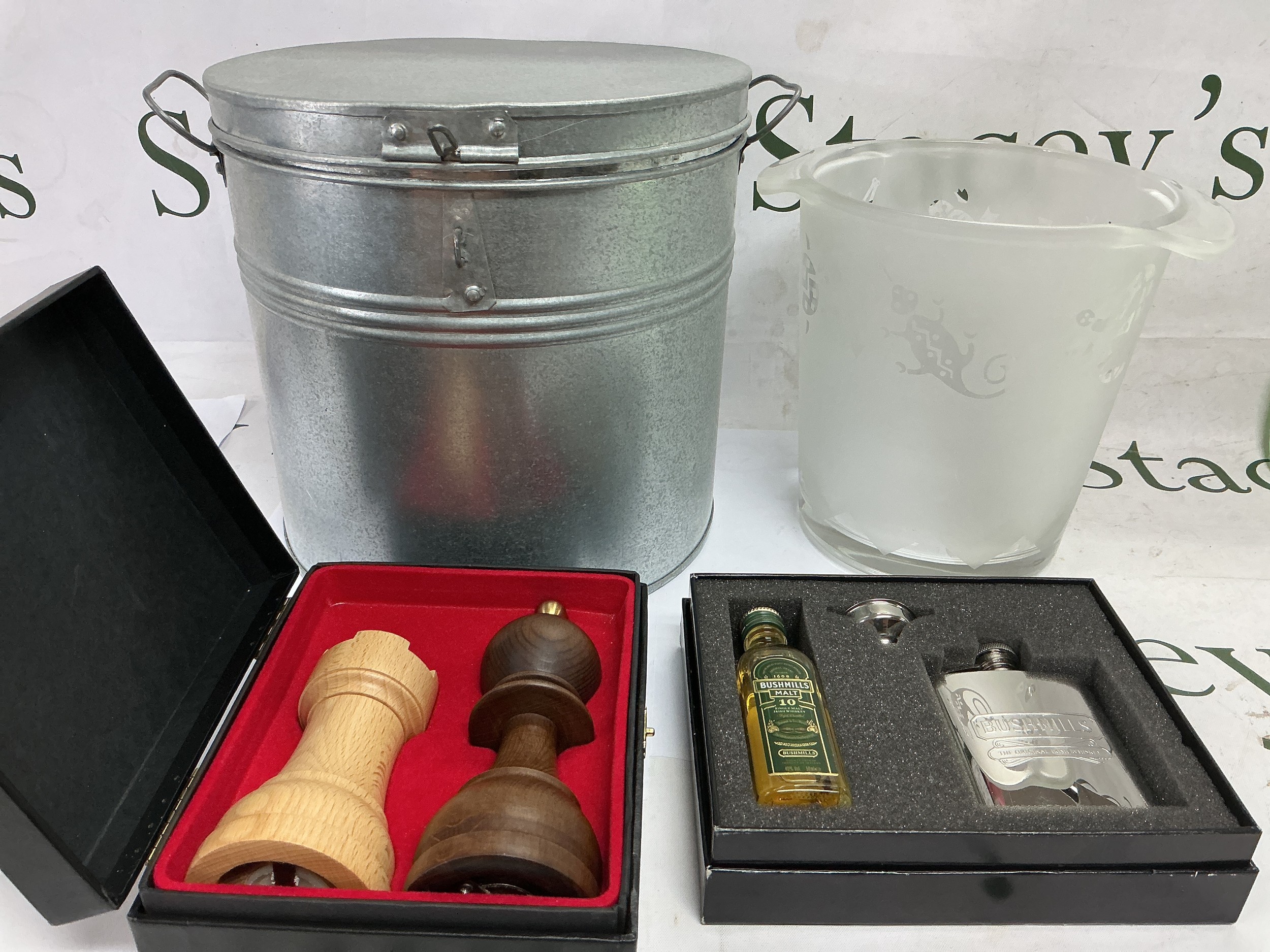 An ice bucket, boxed salt and pepper set modelled as chess pieces and a boxed hip flask and miniature Bushmills whiskey.