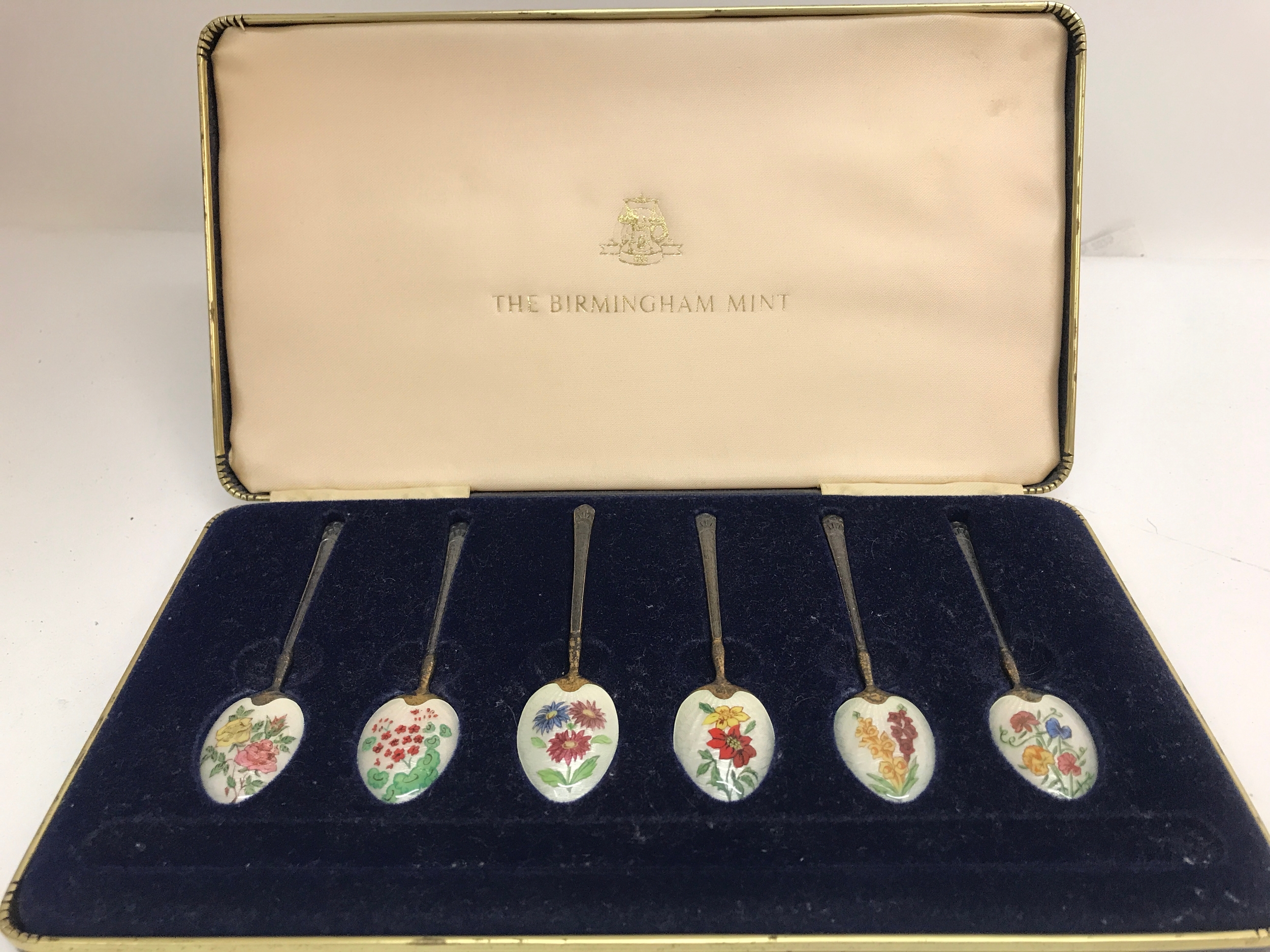 A cased set of silver and enamel spoons, 76g total weight 