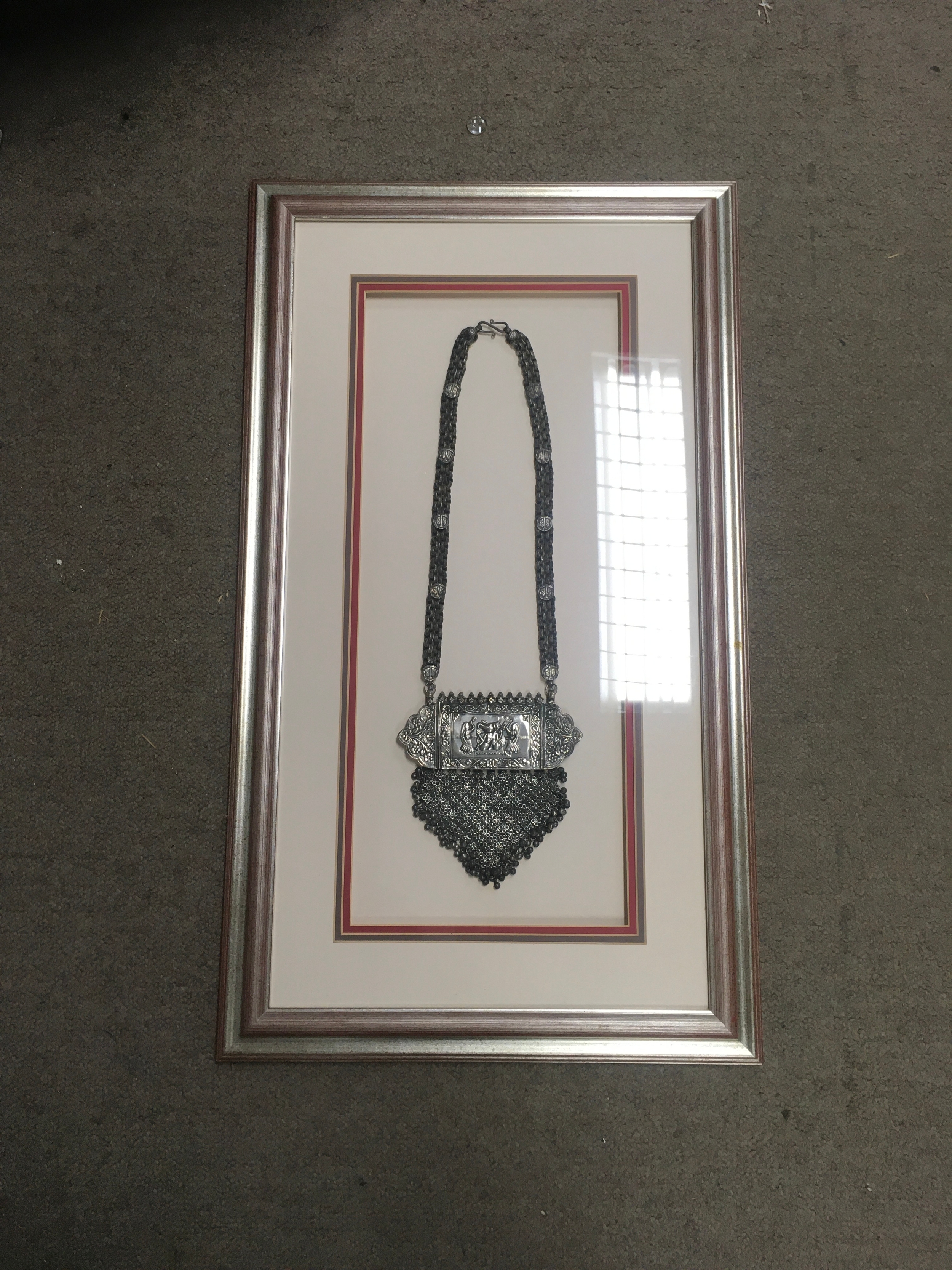 Framed silver eastern jewellery