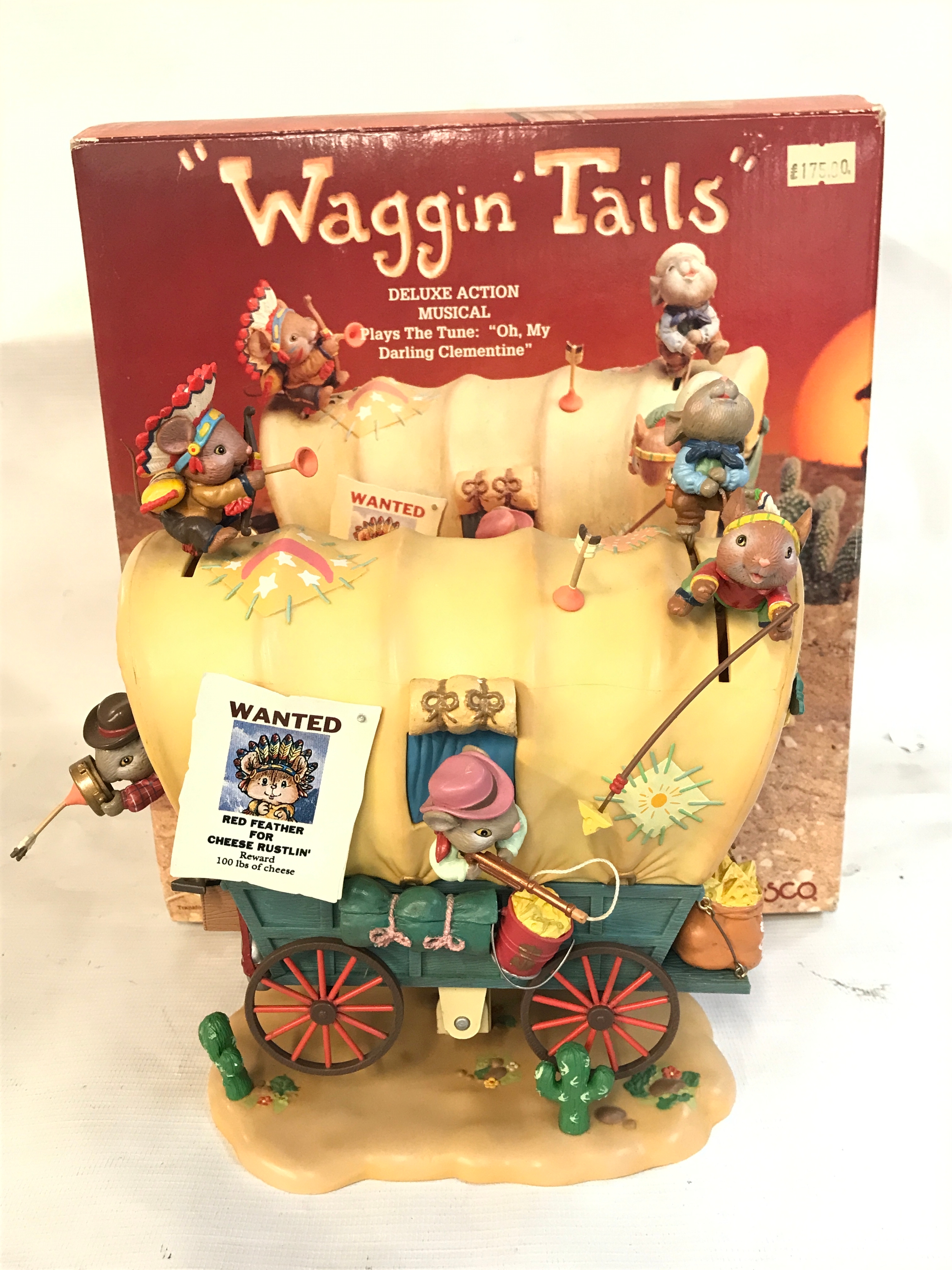 A boxed 1992 Enesco Waggin Tails Cowboys & Indians Deluxe Multi-Action Musical Box