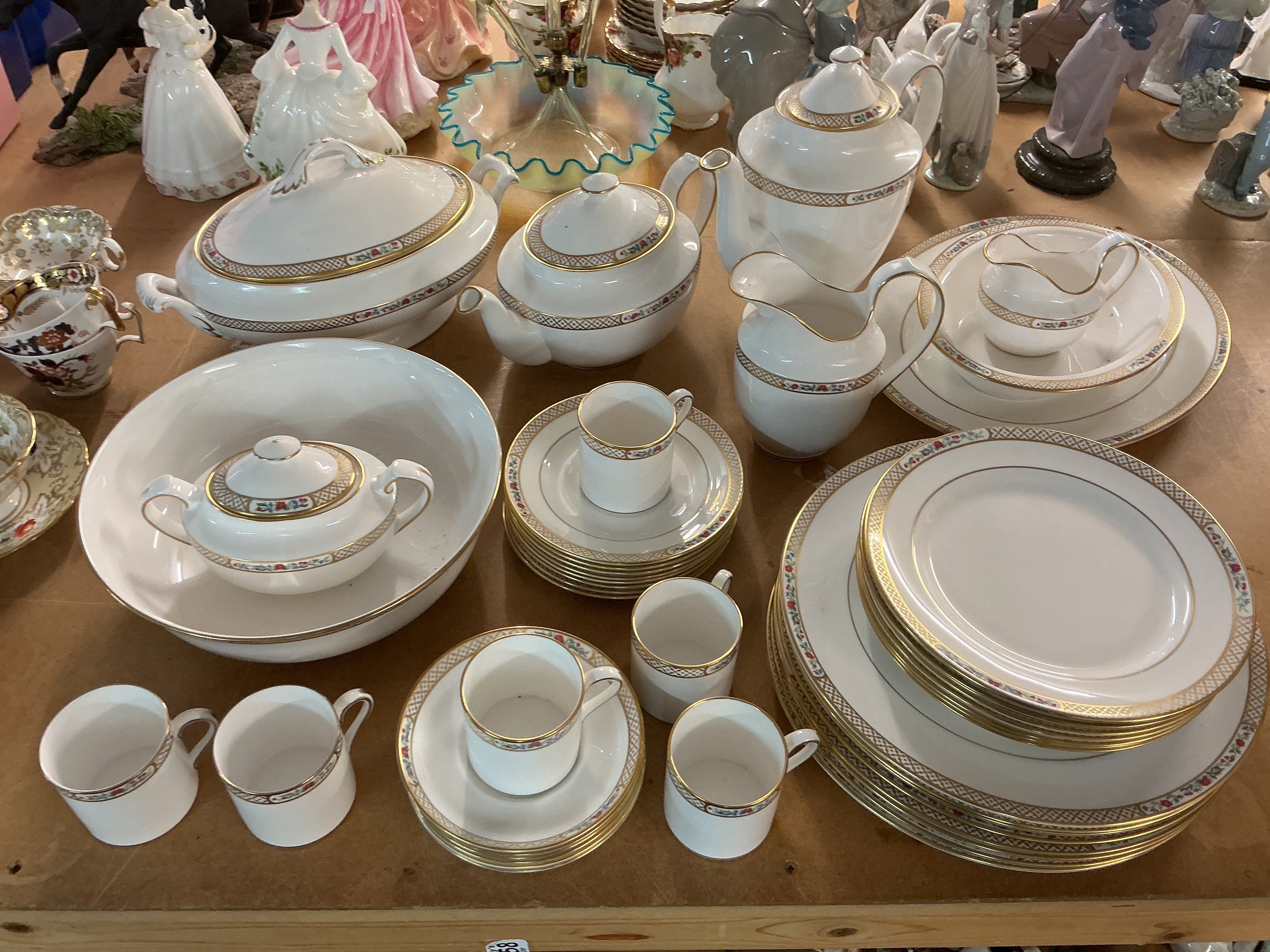 A Spode dinner service in Golden Trellis pattern.