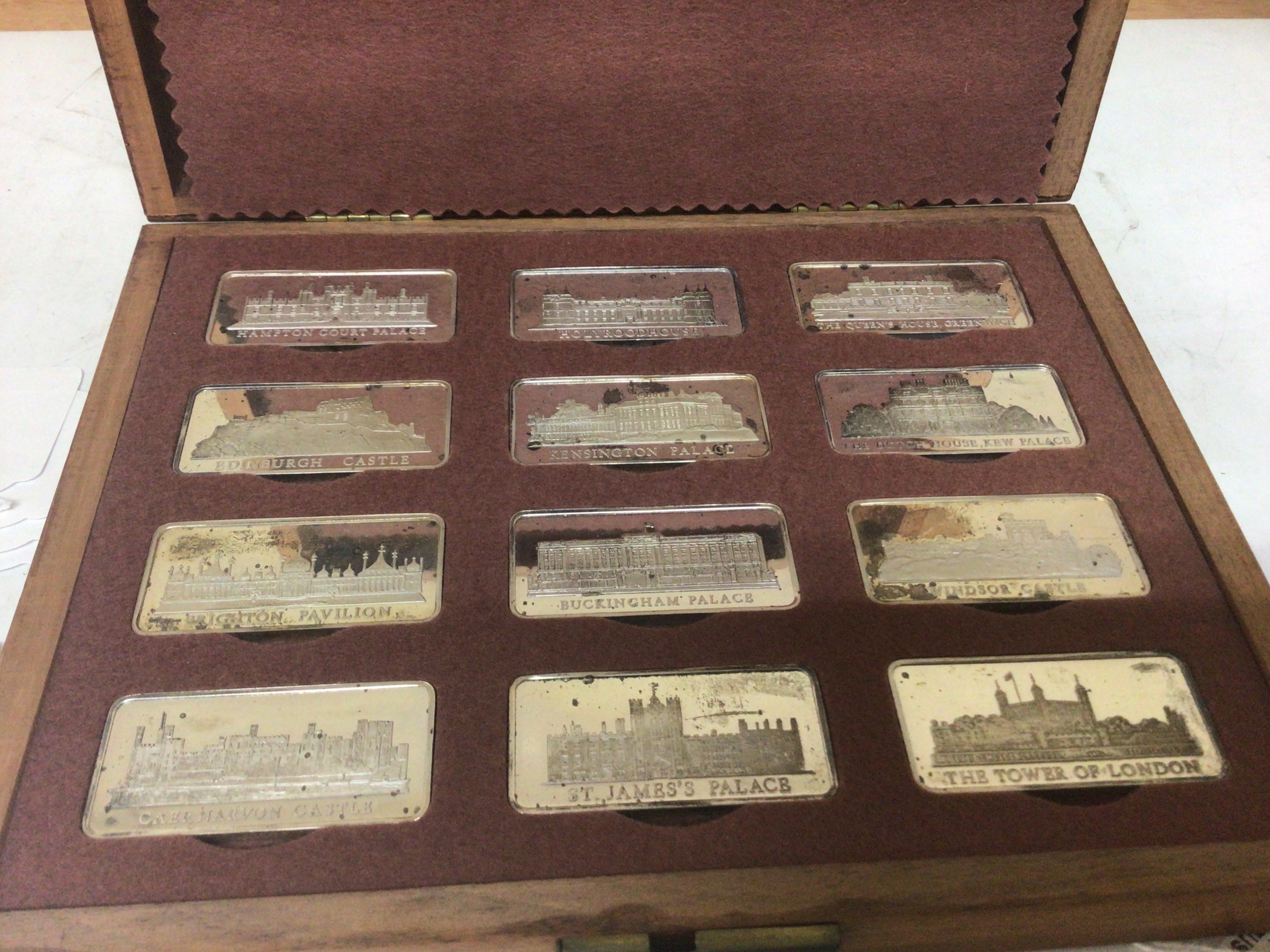 A cased set of silver Troy ounce 31g Silver ingots from the Birmingham Mint each of the twelve ingots representing Royal Palaces. 