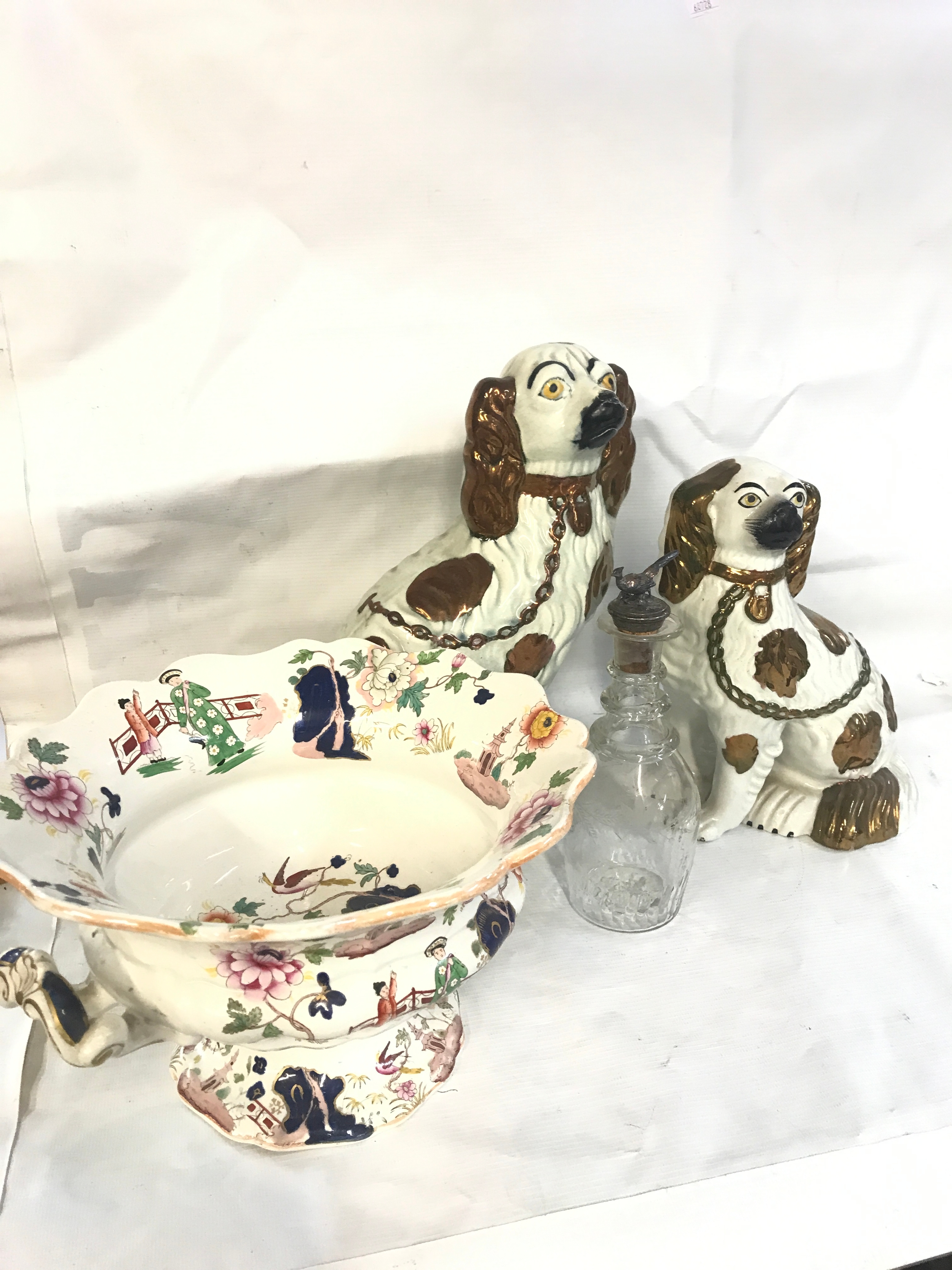 Two Staffordshire dog figures, 19th century ceramic bowl and a decanter with a vine engraving and a fitted metal and cork pheasant topper 