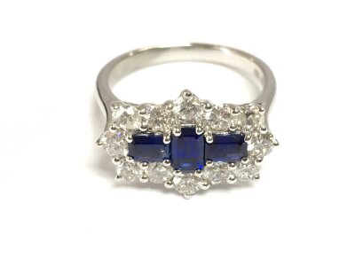 Platinum sapphire and diamond boat style dress ring. Approx 0.92ct sapphire and 1.15ct diamonds size N