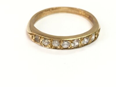 A 9ct gold half hoop eternity ring. Size Q and 2.58g