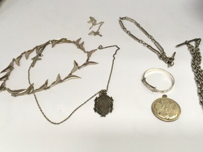 A collection of assorted silver items including watch chain bracelet etc. 117g total.