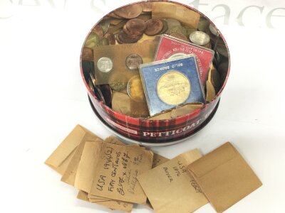 A tin of various coins