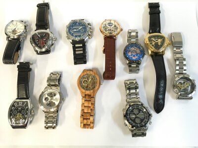 A collection of assorted men’s fashion watches and copy watches.