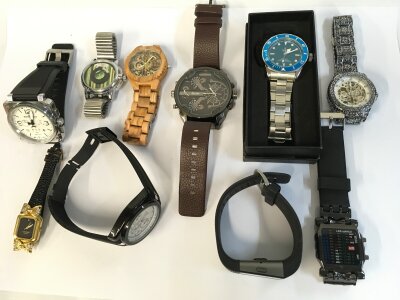 A collection of assorted dress and copy watches.