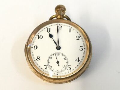 A gold plate button wind pocket watch with white enamel face and blue hands. Winds and runs. 50mm case.