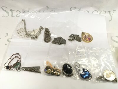 Eleven named necklaces in bags