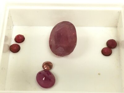 Six small rubies, one medium, one large