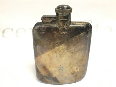 A hallmarked silver hip flask, 110g total weight