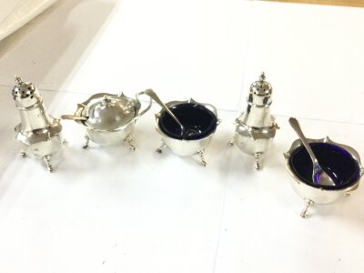 A silver hallmarked cruet set, 175g total silver weight