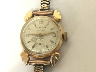 A Vintage 18carat gold cased ladies watch with a gold plated strap.