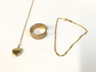 A 9ct gold ring (cut) and a 9ct chain and bracelet. 7.29g total.