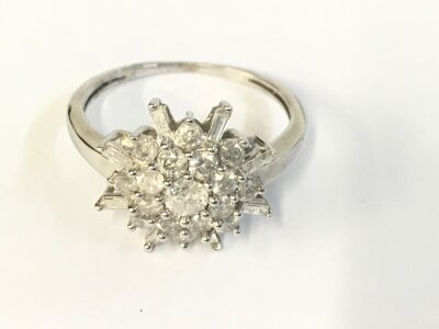 A 9ct white gold cluster ring with approximately 1ct diamonds total.