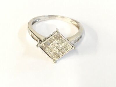 A 9ct white gold diamond ring. Size N set with 2.44g