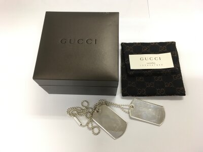 A boxed pair of Gucci silver dog tags.