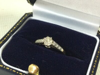 An 18ct diamond solitaire ring. 1.7g. Size L