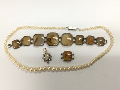 An opal pendant, pearl necklace with a white metal clasp, stone bracelet etc.