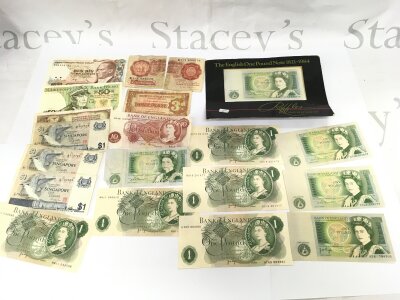 A small collection of bank notes including various GB £1 notes.