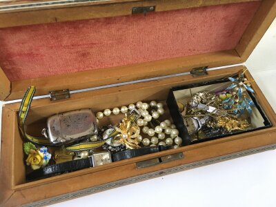 A costume jewellery including brooches, watches, silver hallmarked vesta etc